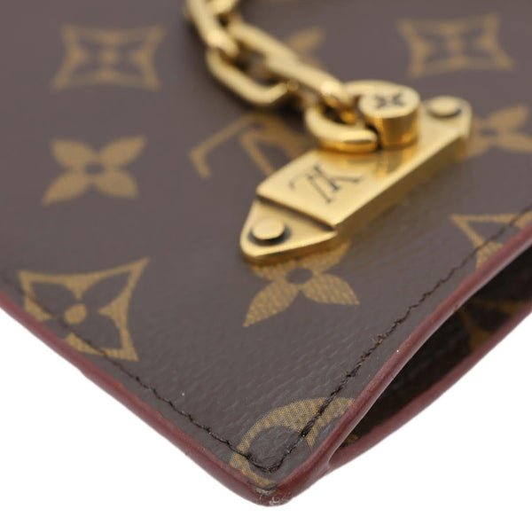 LOUIS VUITTON Legacy Monogram Canvas Chain Clutch Brown