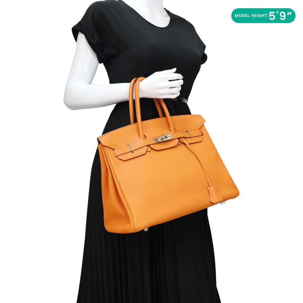 Hermès Birkin 35 Orange Togo Leather Tote Bag - Model Holding