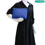 CHANEL O Case Large Quilted Lambskin Leather Clutch Blue