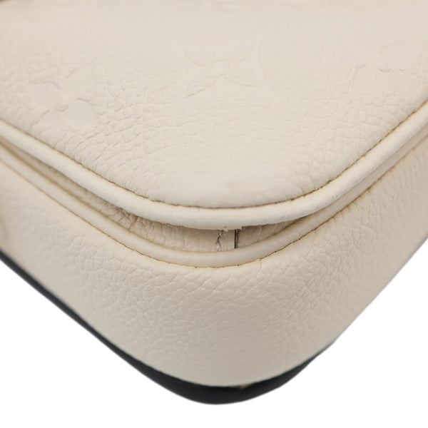 LOUIS VUITTON Metis East West Pochette Empreinte Leather Crossbody Bag Cream