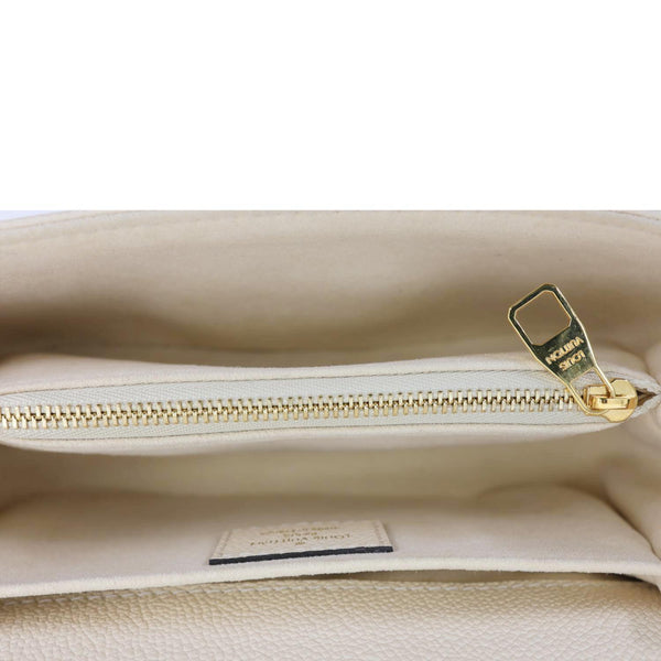 LOUIS VUITTON Metis East West Pochette Empreinte Leather Crossbody Bag Cream