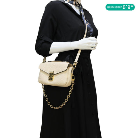 LOUIS VUITTON Metis East West Pochette Empreinte Leather Crossbody Bag Cream