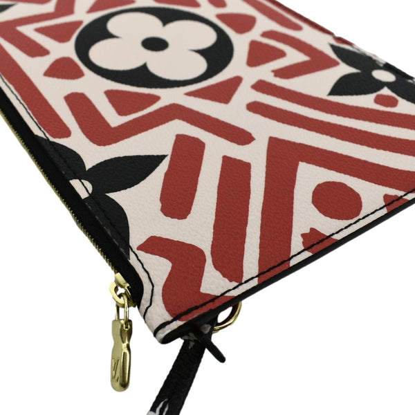 LOUIS VUITTON Neverfull Crafty Giant Monogram Canvas Wristlet Pouch Red