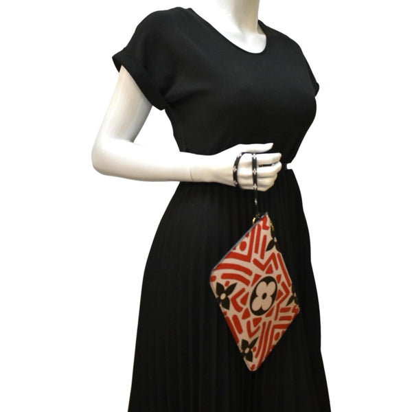 LOUIS VUITTON Neverfull Crafty Giant Monogram Canvas Wristlet Pouch Red