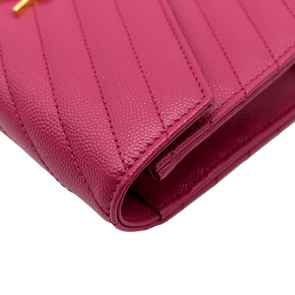 YVES SAINT LAURENT Cassandre Grain De Poudre Embossed Chain Envelope Bag Fuchsia