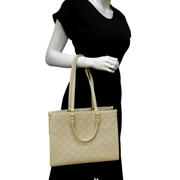 LOUIS VUITTON Onthego Spring City MM Monogram Empreinte Leather Shoulder Bag Cream