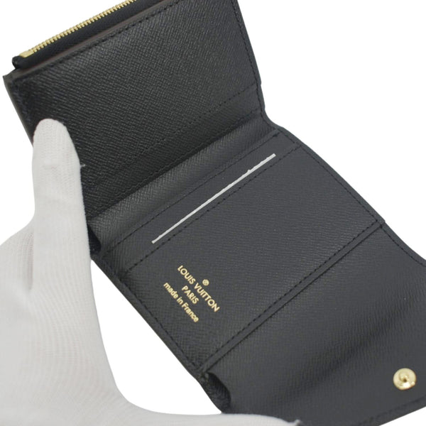 LOUIS VUITTON Zoe Monogram Reverse Canvas Wallet Brown