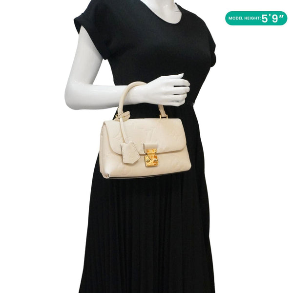 LOUIS VUITTON Madeleine MM Monogram Empreinte Leather Top Handle Bag White