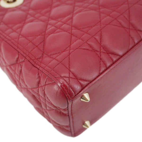 Side view of Lady Dior Red Leather Bag with Cannage quilting