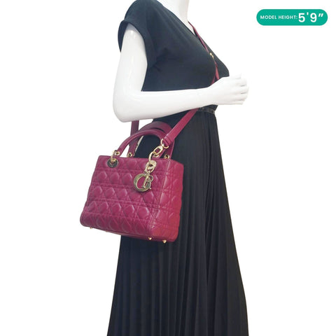 Model carrying Lady Dior Medium Cannage Leather Crossbody Bag