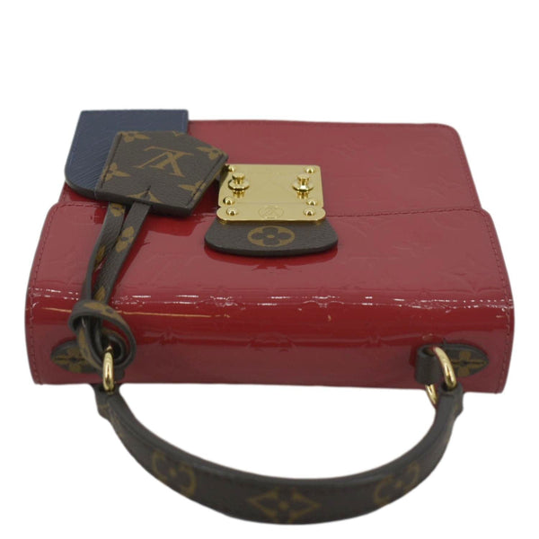 LOUIS VUITTON Spring Street Crossbody Bag red color with land scap view