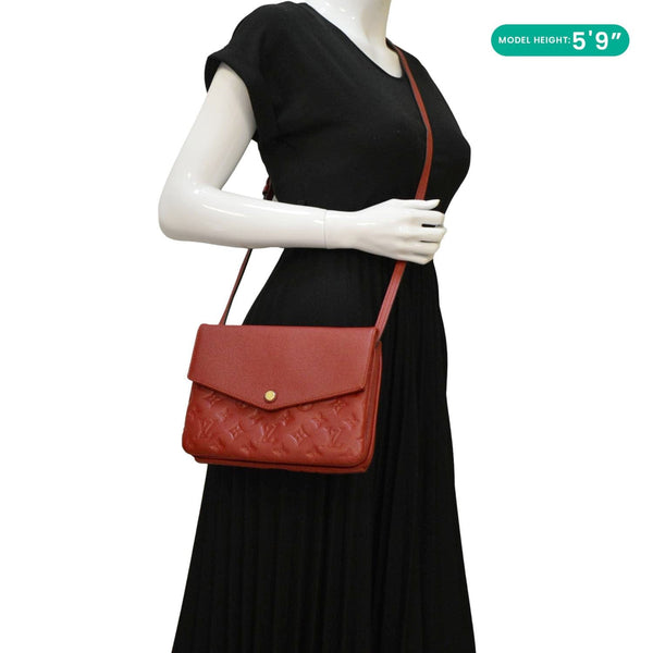 LOUIS VUITTON Twice Pochette Monogram Empreinte Crossbody Bag Red