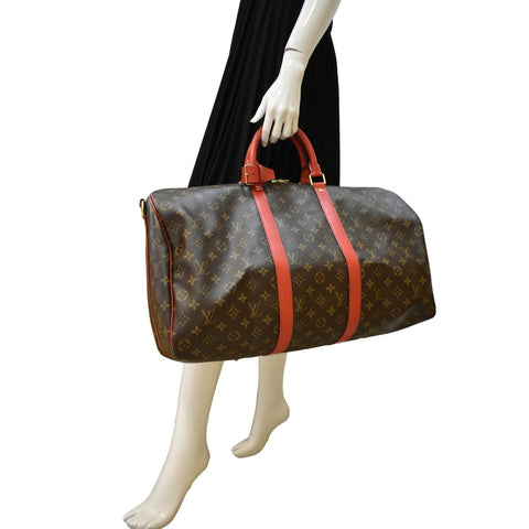 LOUIS VUITTON Keepall 55 Bandouliere Monogram Canvas Travel Bag Red
