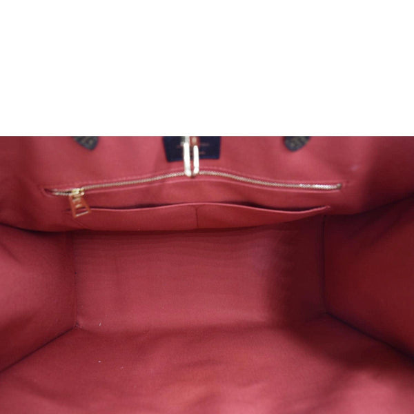 LOUIS VUITTON Onthego GM Monogram Marvel Brown Shoulder bag with in side view