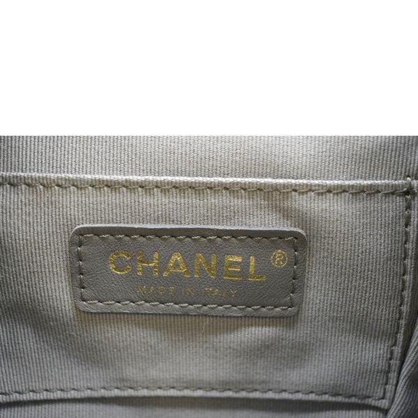 Black leather shoulder bag with gold chain