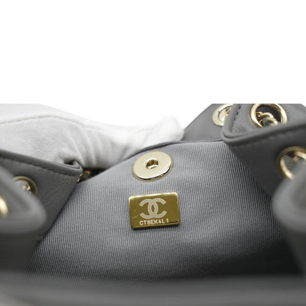 Mini leather bucket bag with crossbody strap