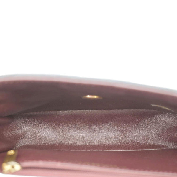 CHANEL Black quilted crossbody bag interior with zip pocket