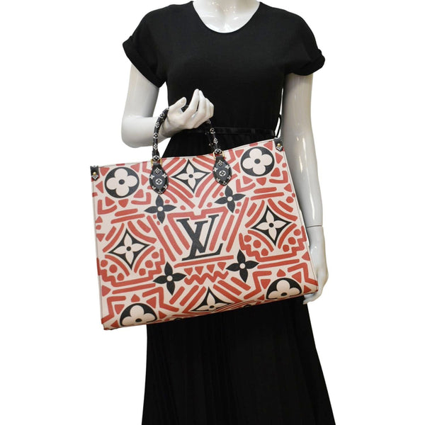 LOUIS VUITTON Onthego GM Crafty Monogram Giant Canvas Shoulder Bag Red