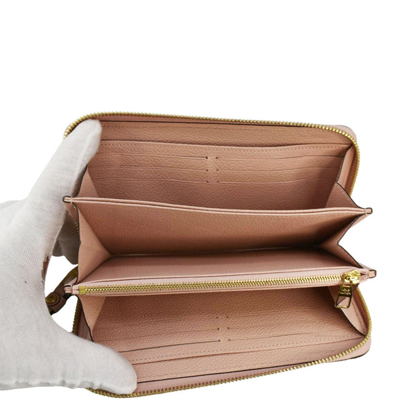 LOUIS VUITTON Clemence Empreinte Leather Wallet Dusty Pink