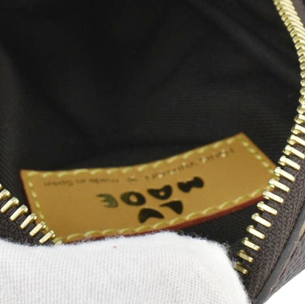 LOUIS VUITTON x Nigo Double Flap Reverse Monogram Canvas Phone Pouch Brown