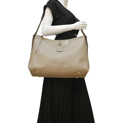 LOUIS VUITTON Carryall MM Monogram Empreinte Shoulder Bag Tourterelle Gray