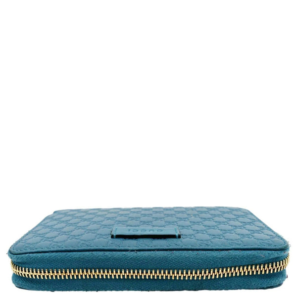 GUCCI Zip Around GG Embossed Leather Wallet Deep Cobalt