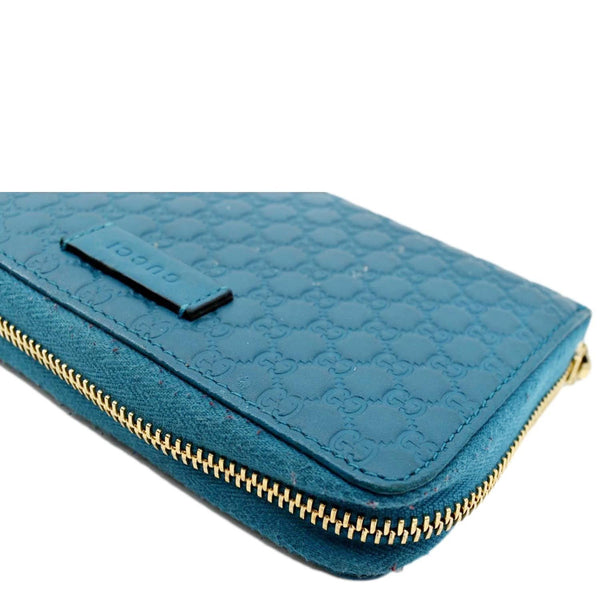 GUCCI Zip Around GG Embossed Leather Wallet Deep Cobalt