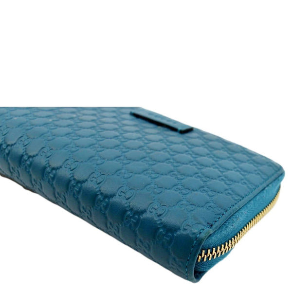 GUCCI Zip Around GG Embossed Leather Wallet Deep Cobalt
