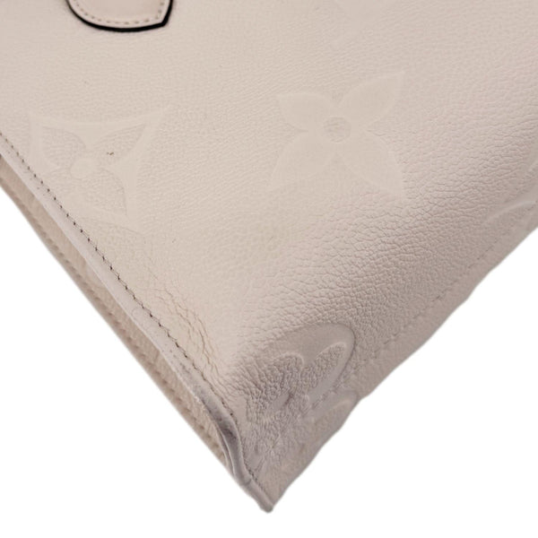 LOUIS VUITTON Onthego PM Giant Monogram Empreinte Leather Satchel Bag Cream