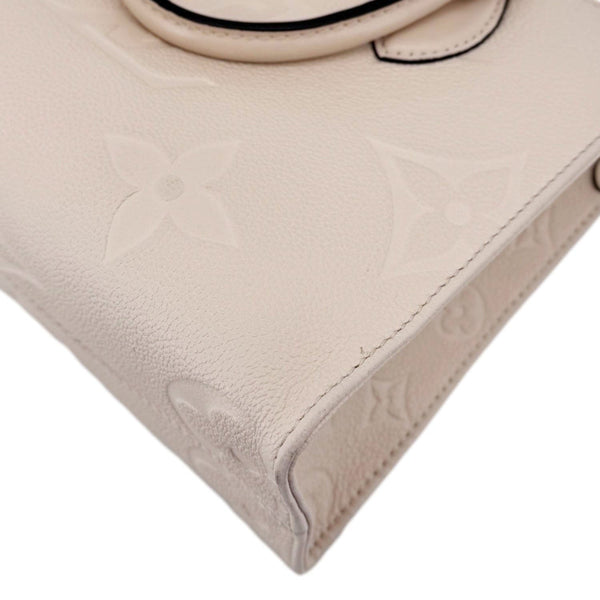 LOUIS VUITTON Onthego PM Giant Monogram Empreinte Leather Satchel Bag Cream
