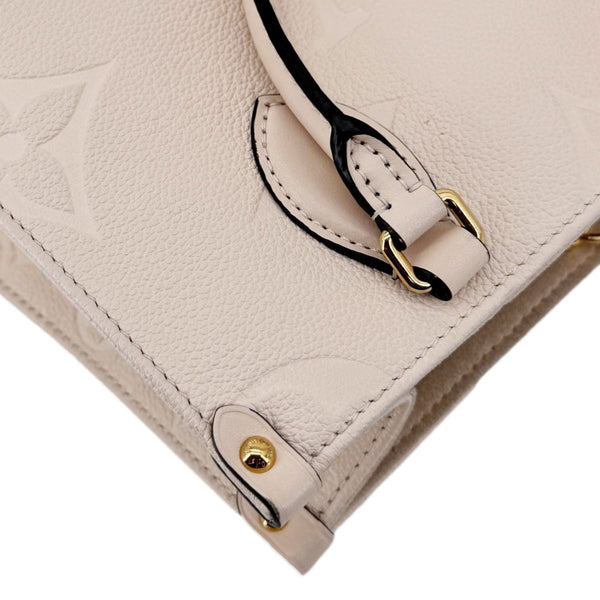 LOUIS VUITTON Onthego PM Giant Monogram Empreinte Leather Satchel Bag Cream