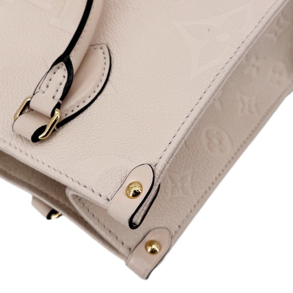 LOUIS VUITTON Onthego PM Giant Monogram Empreinte Leather Satchel Bag Cream