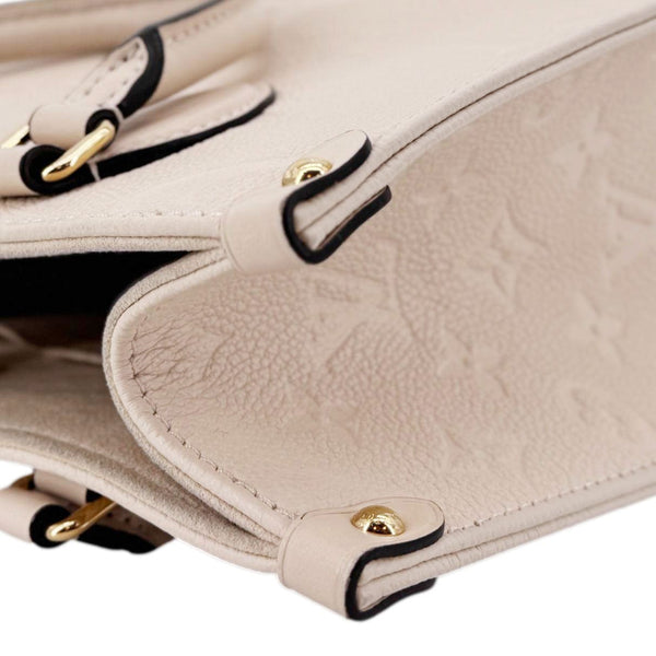 LOUIS VUITTON Onthego PM Giant Monogram Empreinte Leather Satchel Bag Cream
