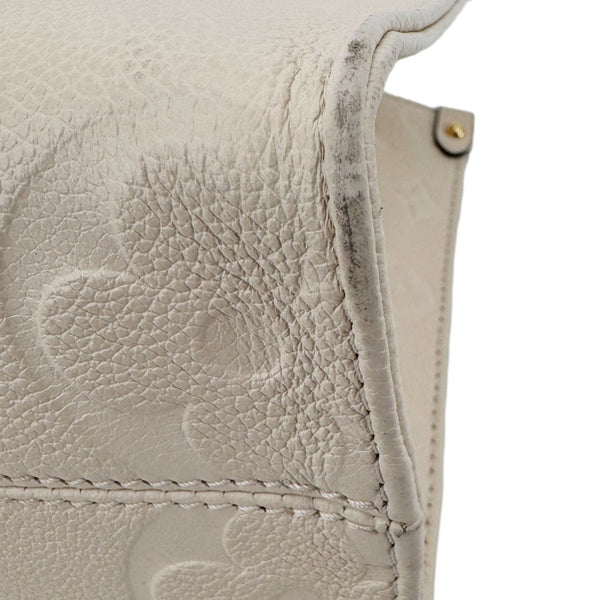 LOUIS VUITTON Onthego PM Giant Monogram Empreinte Leather Satchel Bag Cream