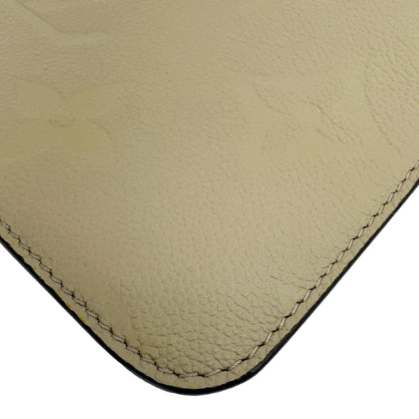 LOUIS VUITTON Empreinte Monogram Leather Wristlet Beige