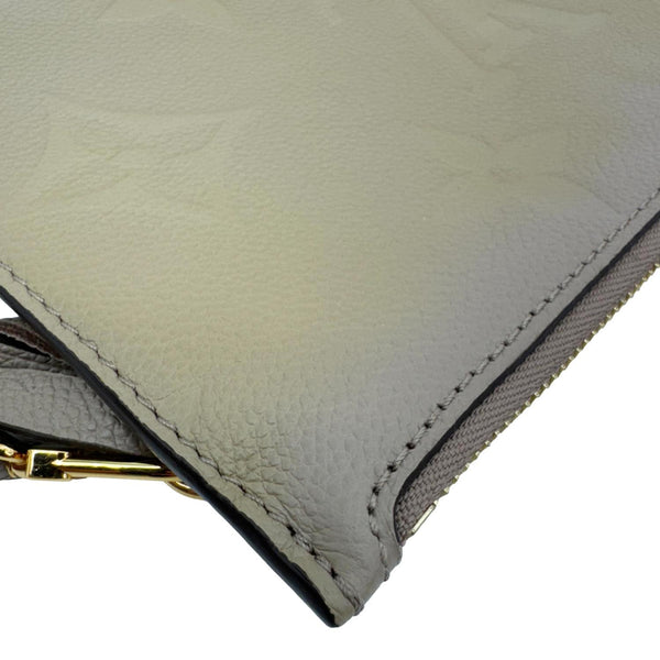 LOUIS VUITTON Empreinte Monogram Leather Wristlet Beige