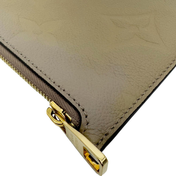 LOUIS VUITTON Empreinte Monogram Leather Wristlet Beige
