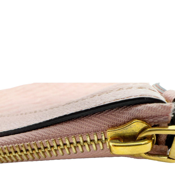 LOUIS VUITTON Daily Pouch Empreinte Leather Clutch Rose Poudre