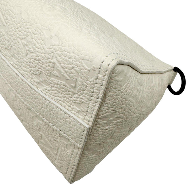 LOUIS VUITTON Triangle Monogram Empreinte Leather Shoulder Bag Off White