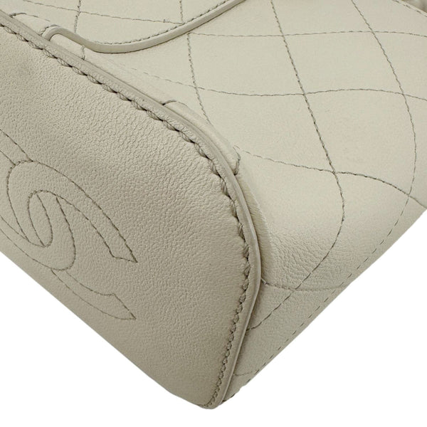 CHANEL CC Drawstring Quilted Leather Crossbody Bucket Bag Cream