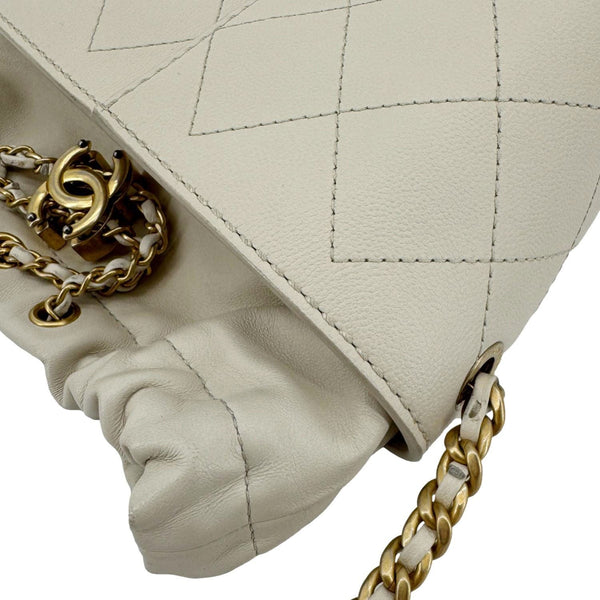 CHANEL CC Drawstring Quilted Leather Crossbody Bucket Bag Cream