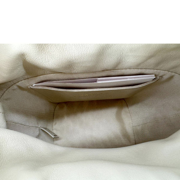 CHANEL CC Drawstring Quilted Leather Crossbody Bucket Bag Cream