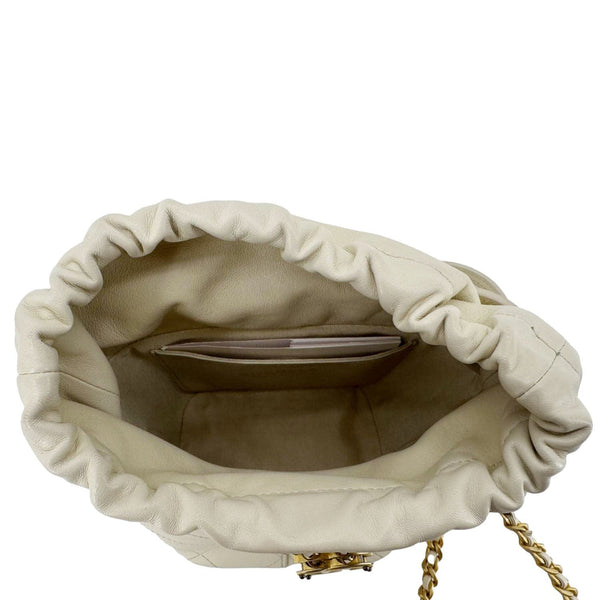 CHANEL CC Drawstring Quilted Leather Crossbody Bucket Bag Cream