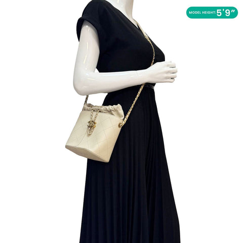 CHANEL CC Drawstring Quilted Leather Crossbody Bucket Bag Cream