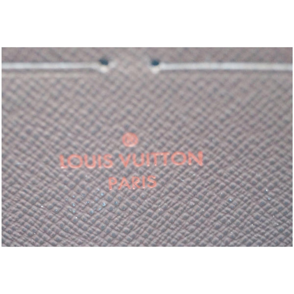 LOUIS VUITTON Zip Around Damier Ebene Wallet Brown