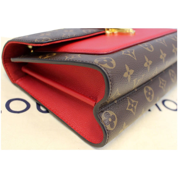 Louis Vuitton Victoire Monogram Canvas Bag side view