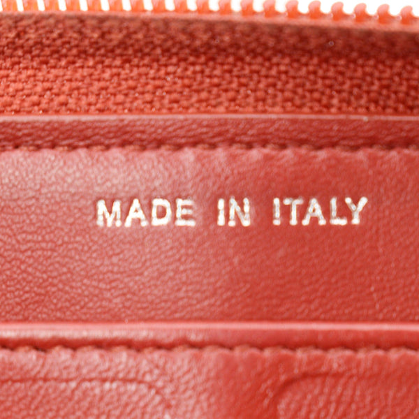 CHANEL Zippy Camellia Embossed Leather Wallet Red