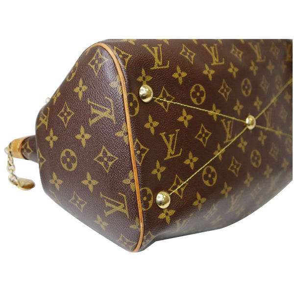 Louis Vuitton Tivoli GM Monogram Canvas bag brass button.