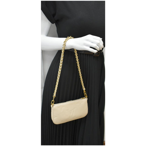LOUIS VUITTON Multi Pochette Accessories Empreinte Bag Cream