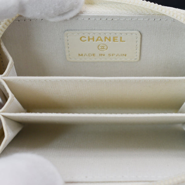 CHANEL Caviar Quilted Small Boy Zip Around Wallet White